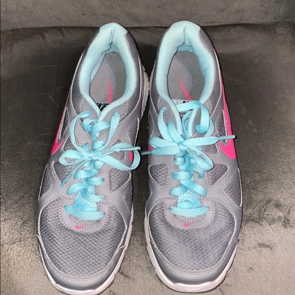 Nike Women’s Gray Athletic Shoes with Pink Swoosh and Light Blue Accents